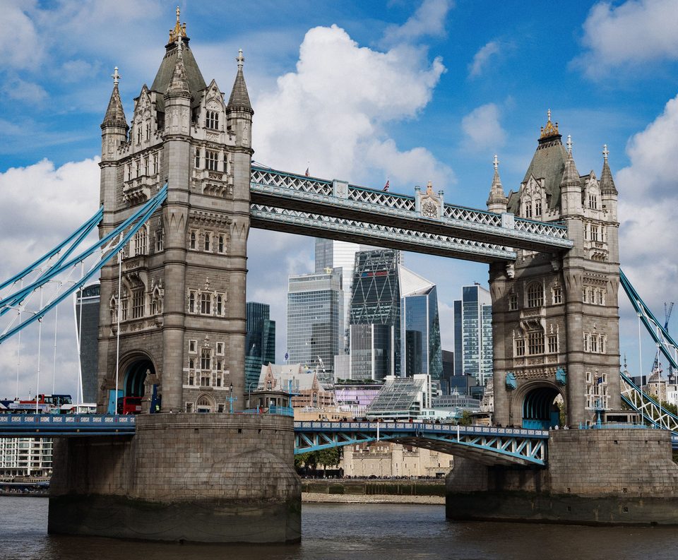 Tower Bridge over the Thames in London, with the City’s skyscrapers behind it