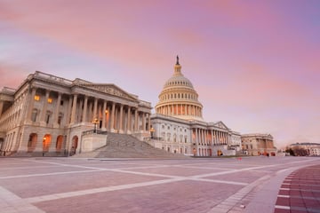 The U.S. Capitol in Washington, D.C., under a pink sky at sunset